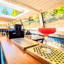 Modern boat bar interior with a large cocktail on the counter.